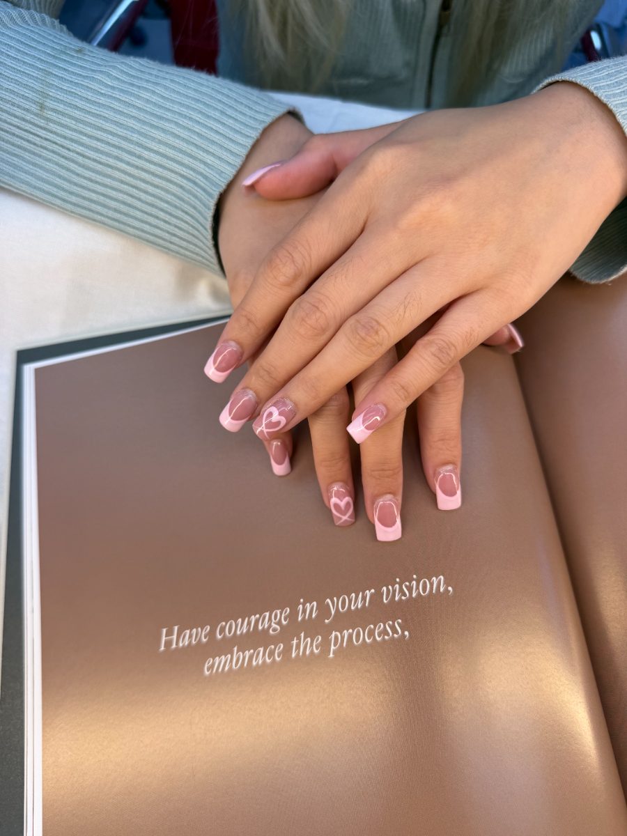 Pink French tips with hand-painted hearts by our San Jose nail techs